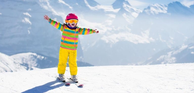 kind, wat nodig voor een skivakantie met kinderen - Gezin op